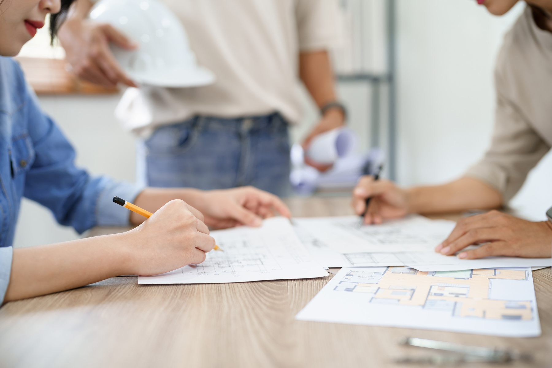 Concept of engineering consulting, Engineer team point blueprint
